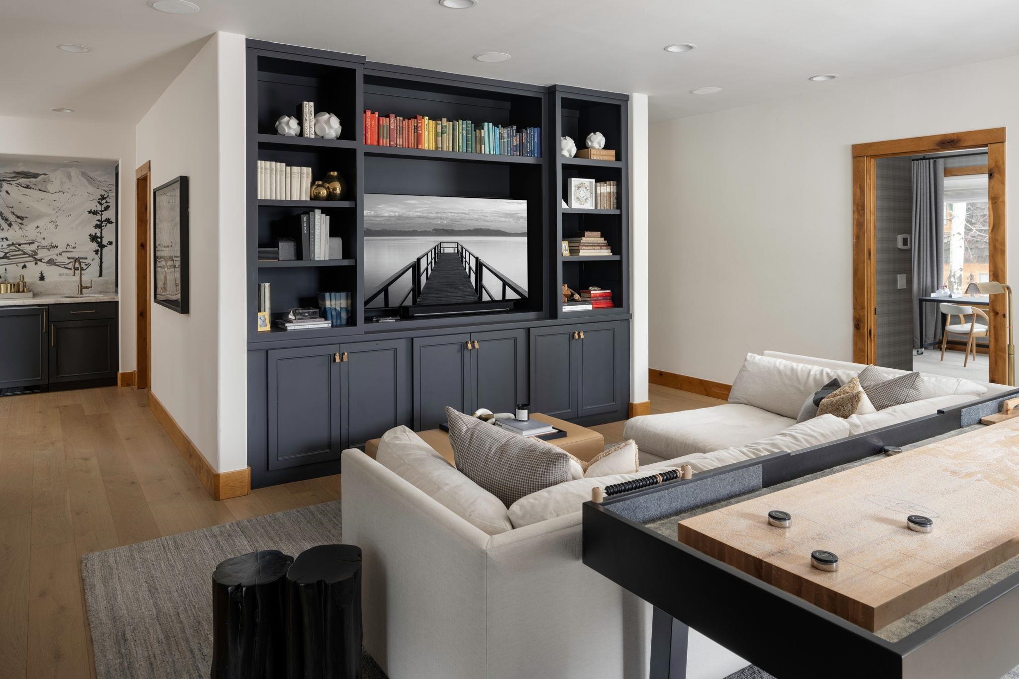 1301 Sandy Way Olympic Valley, CA 96146 - Photo 8 of 21 a living room with furniture and a book shelf