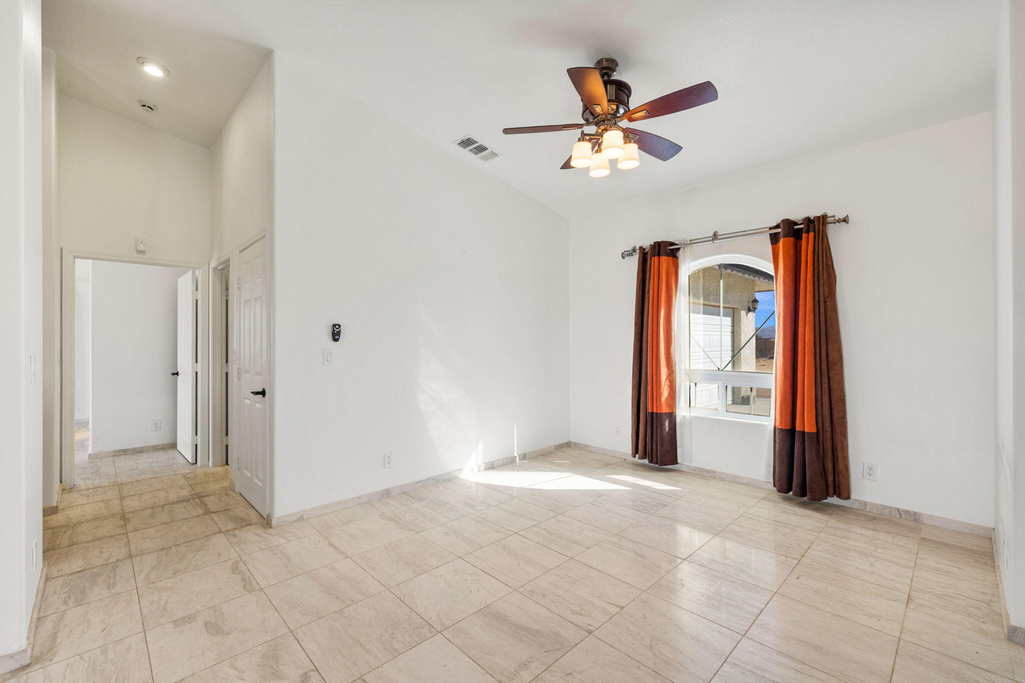 62734 Starlight Street Joshua Tree, CA 92252 - Photo 11 of 60 a view of a livingroom with a ceiling fan and window