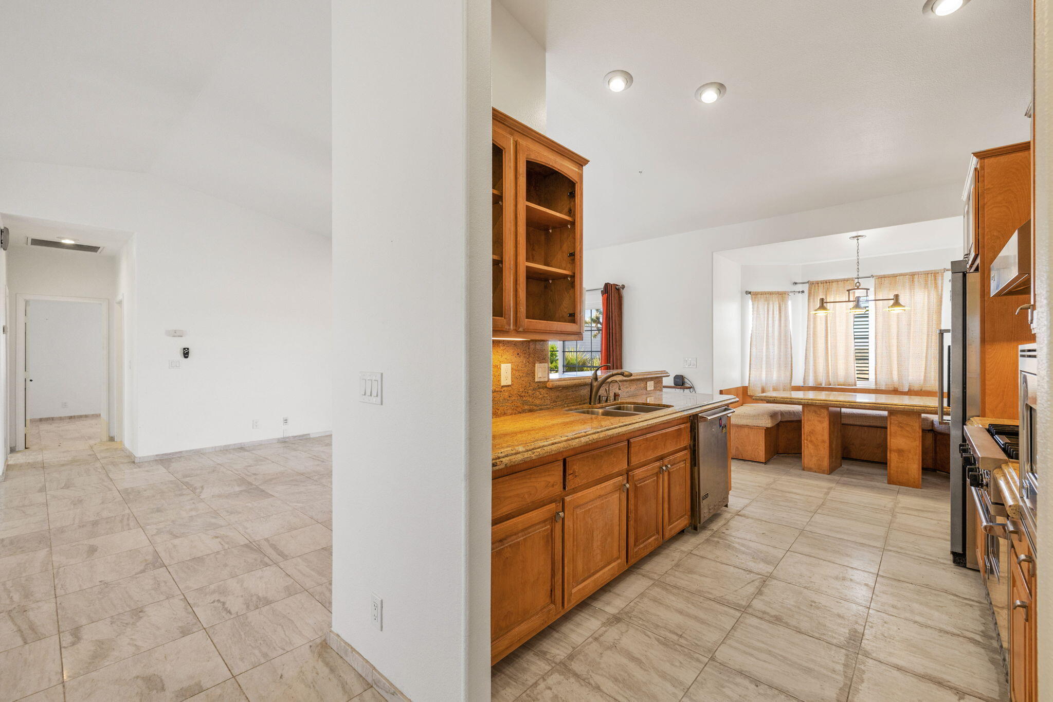 62734 Starlight Street Joshua Tree, CA 92252 - Photo 22 of 60 a large bathroom with a granite countertop double vanity sink a bathtub and window