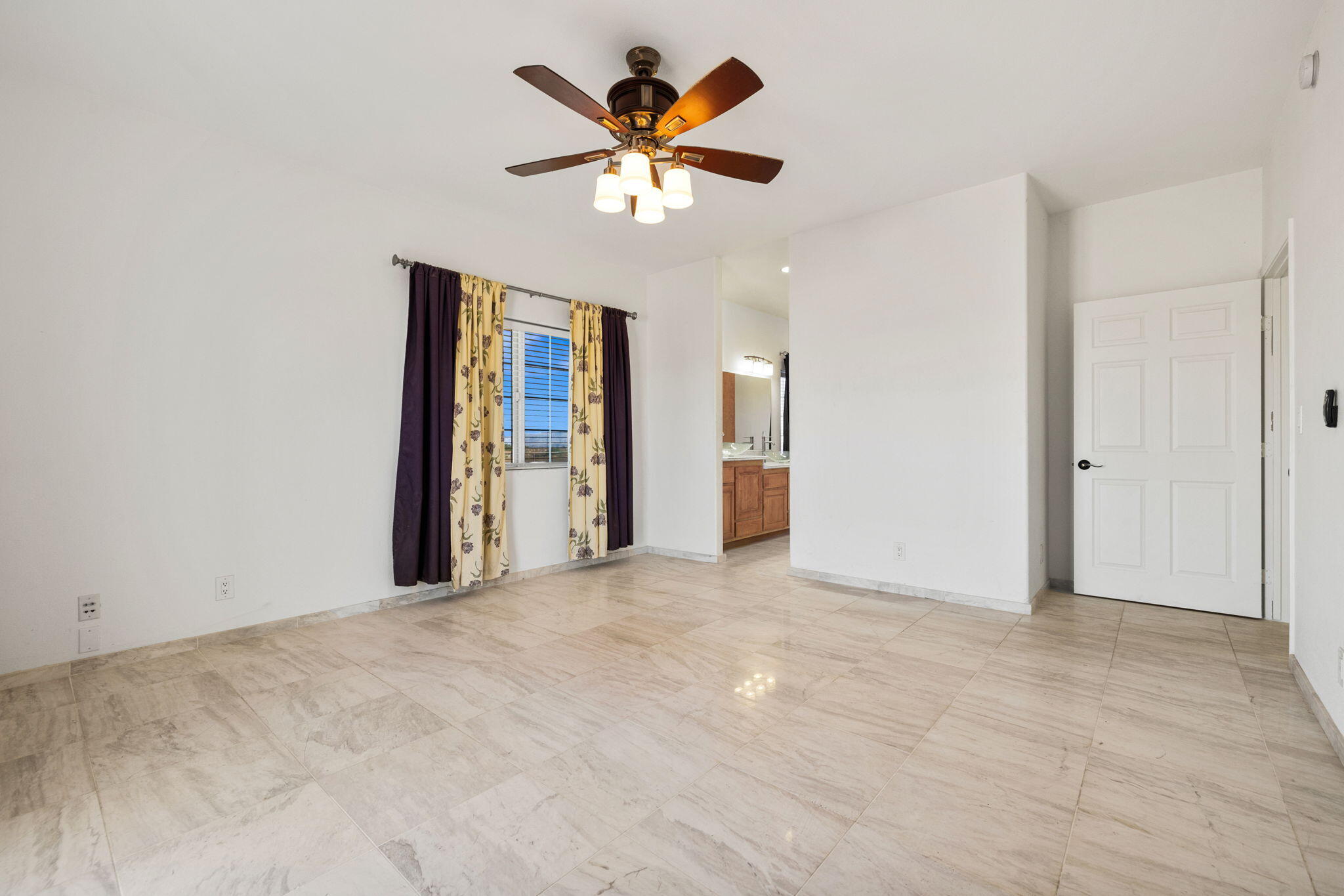 62734 Starlight Street Joshua Tree, CA 92252 - Photo 26 of 60 an empty room with ceiling fan and window