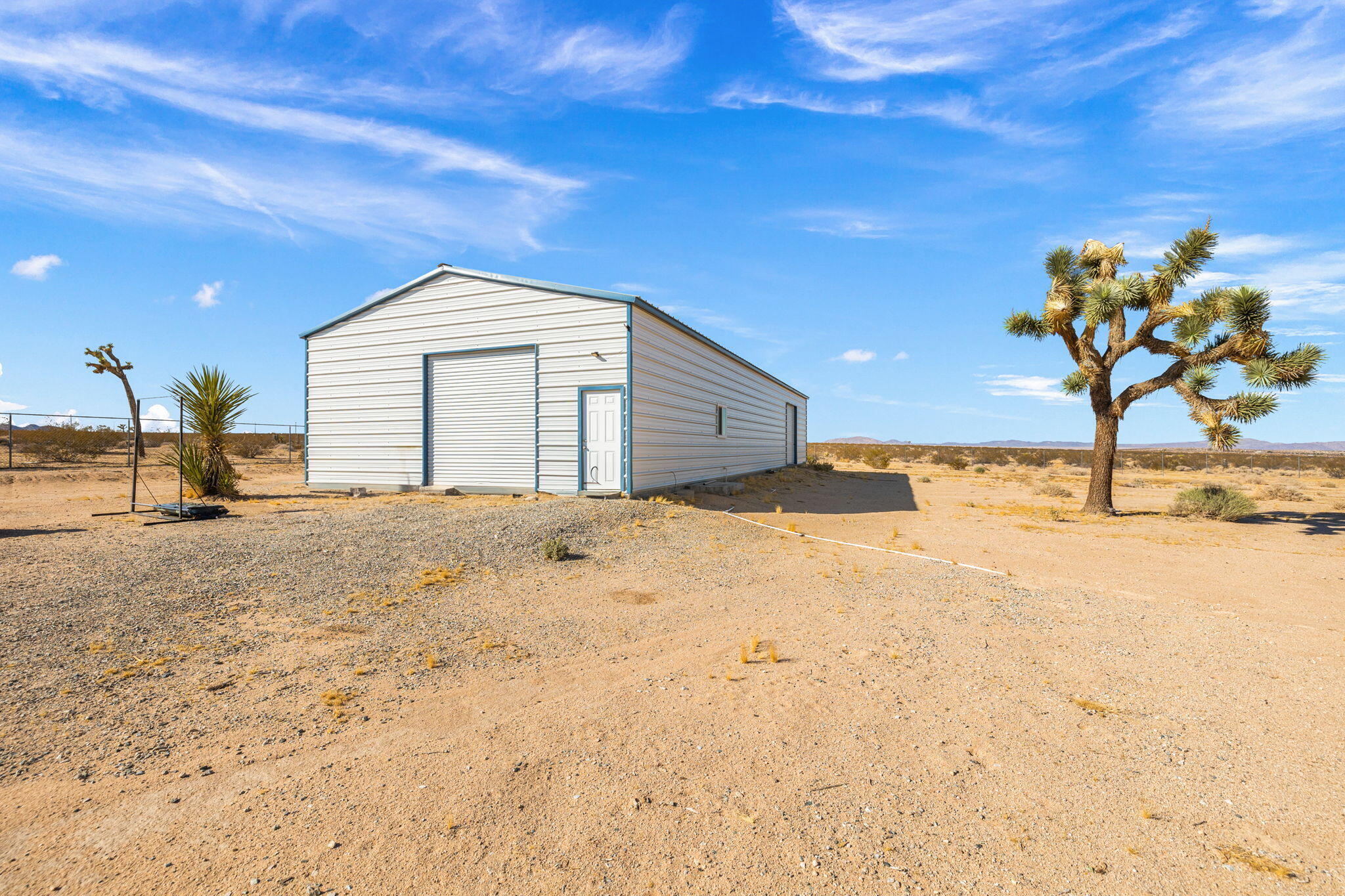 62734 Starlight Street Joshua Tree, CA 92252 - Photo 45 of 60 a view of a house with a snow in the yard