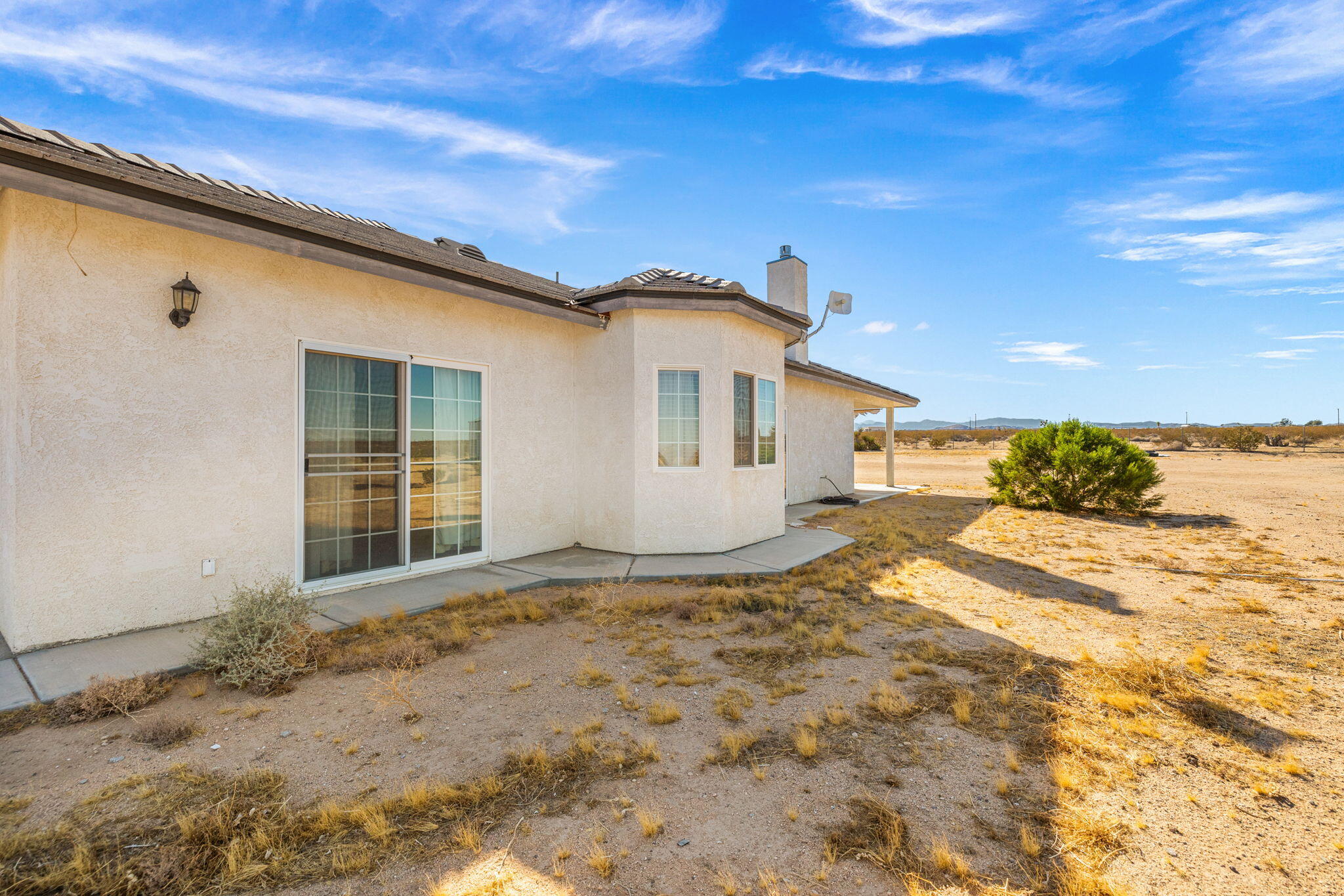 62734 Starlight Street Joshua Tree, CA 92252 - Photo 52 of 60 a view of a house with a snow in the background