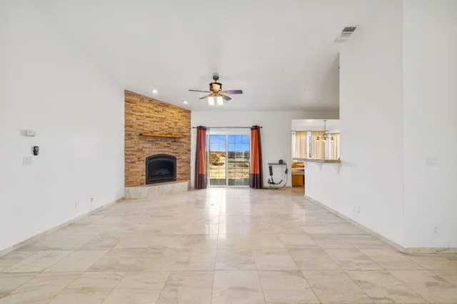 a view of an empty room with a fireplace