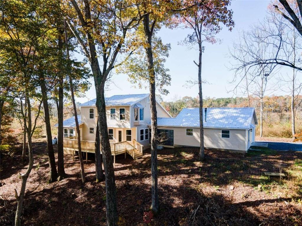 851 Nesbit Loop Northeast Resaca, GA 30735 - Photo 1 of 1 a view of house with backyard and patio