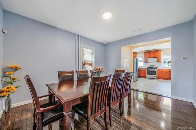a view of a dining room with furniture and window