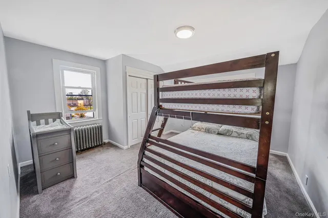 a bedroom with a bunk bed and a dresser