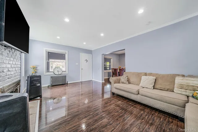 a living room with fireplace furniture and a flat screen tv
