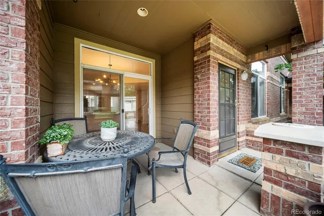 a outdoor space with patio the couches and a potted plant