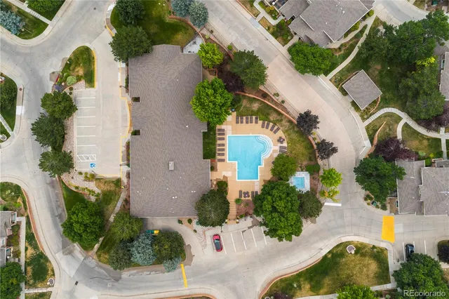 an aerial view of a house with swimming pool and outdoor space