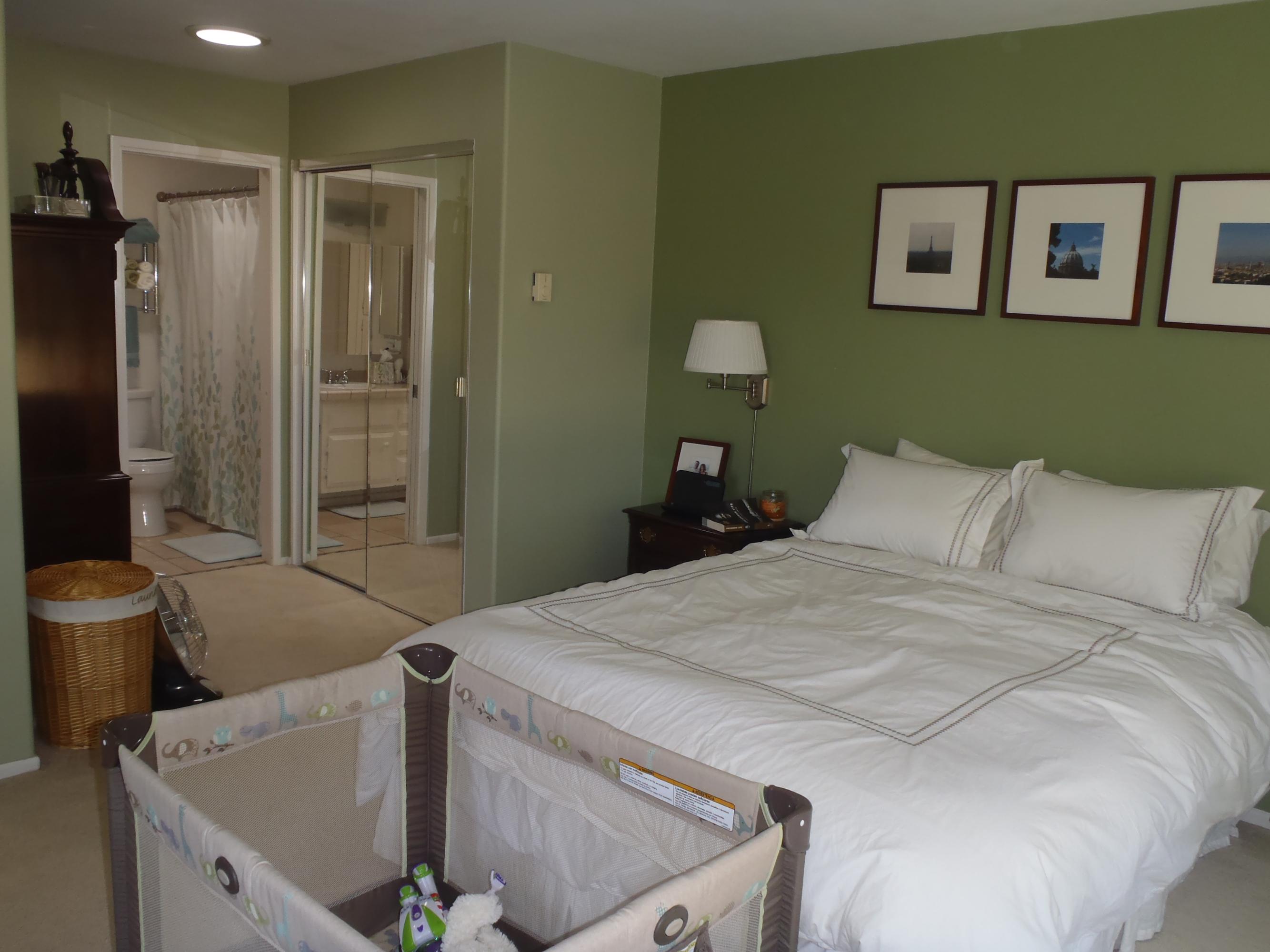 538 Mills Way Goleta, CA 93117 - Photo 13 of 17 a spacious bedroom with a bed and a chandelier