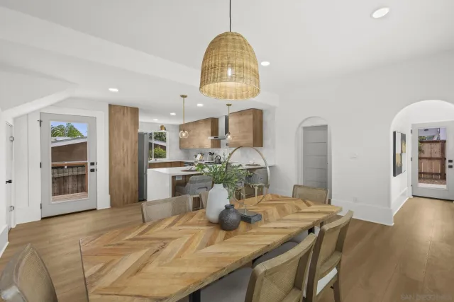 a dining room with furniture and window