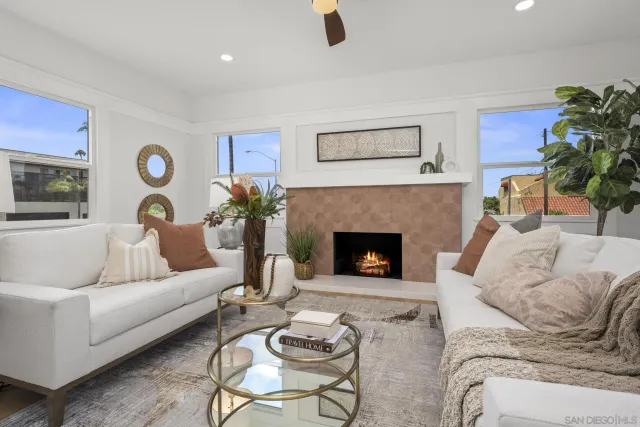 a white vase with white and yellow flowers