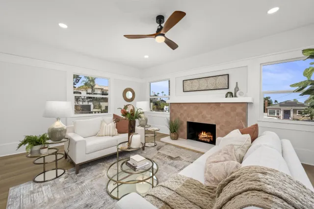 a living room with furniture and a potted plant