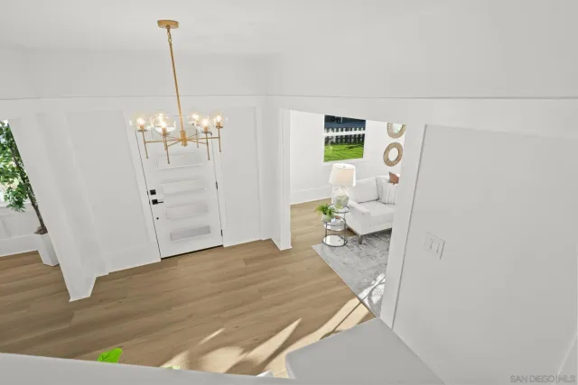 a bedroom with a bed and a view of kitchen