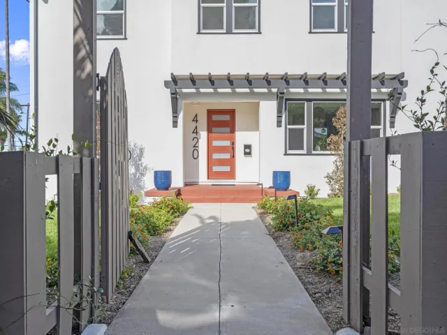 a front view of a house with a yard and porch