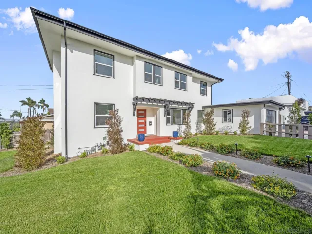a kitchen with center island table and chairs