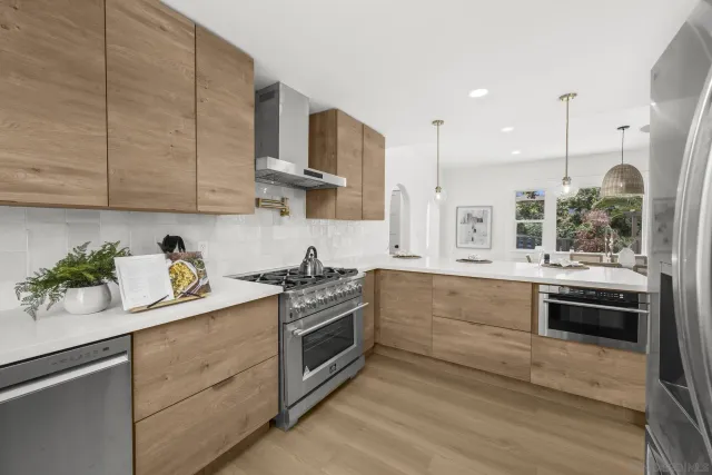 a kitchen with a refrigerator and microwave