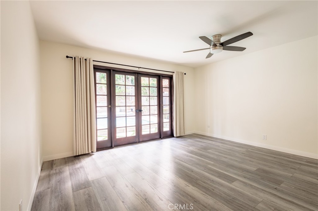 25342 Hugo Road Laguna Niguel, CA 92677 - Photo 28 of 36 Primary Bedroom with French Doors looking out to the swimming pool