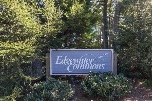 a sign that is sitting in front of a building