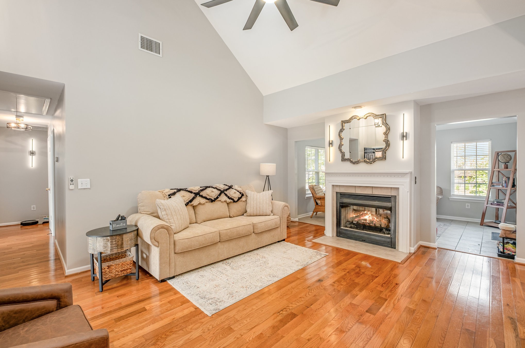 a living room with furniture and a fireplace