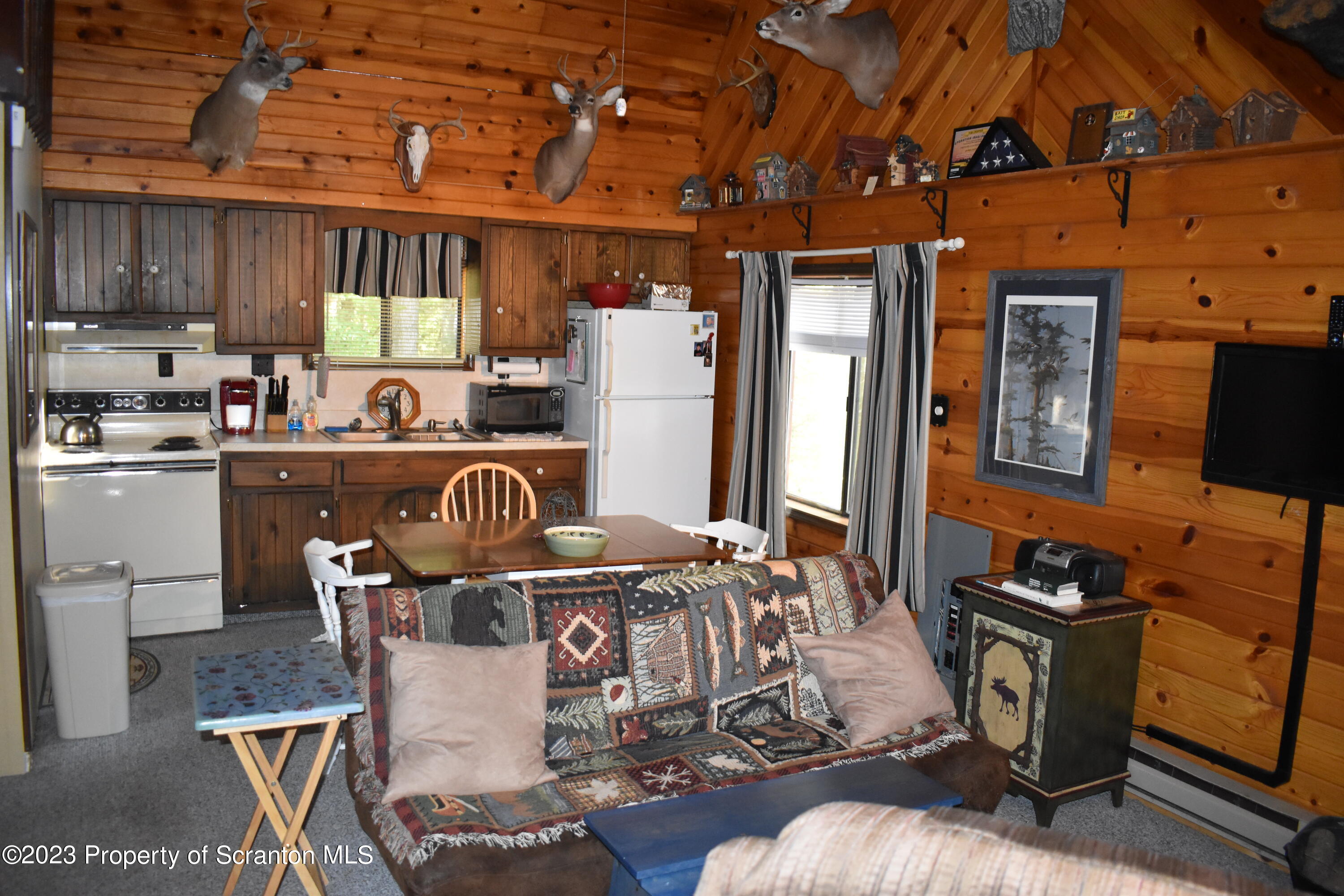 547 Camp Road New Milford, PA 18834 - Photo 11 of 27 a dining room with furniture and wooden floor
