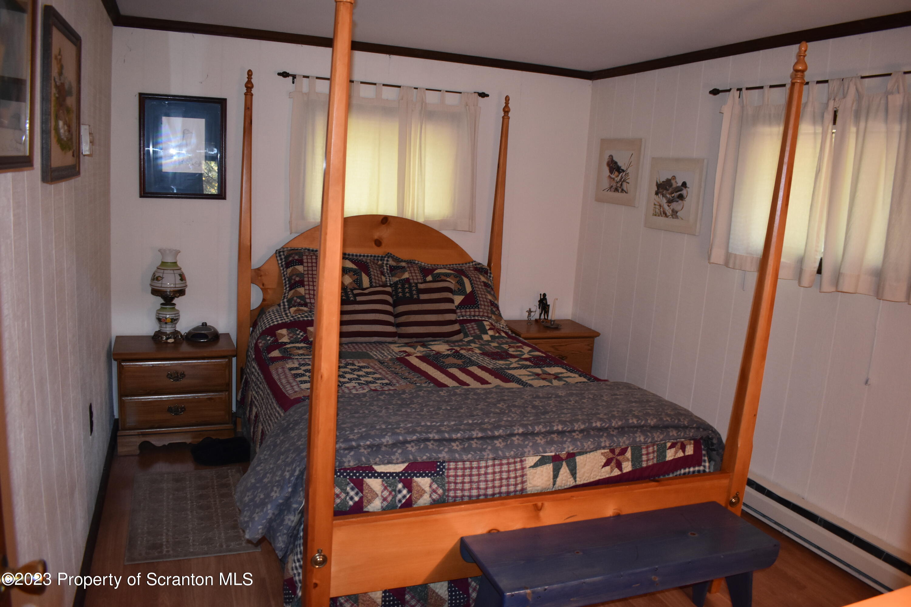 547 Camp Road New Milford, PA 18834 - Photo 12 of 27 a bedroom with a bed and a dresser