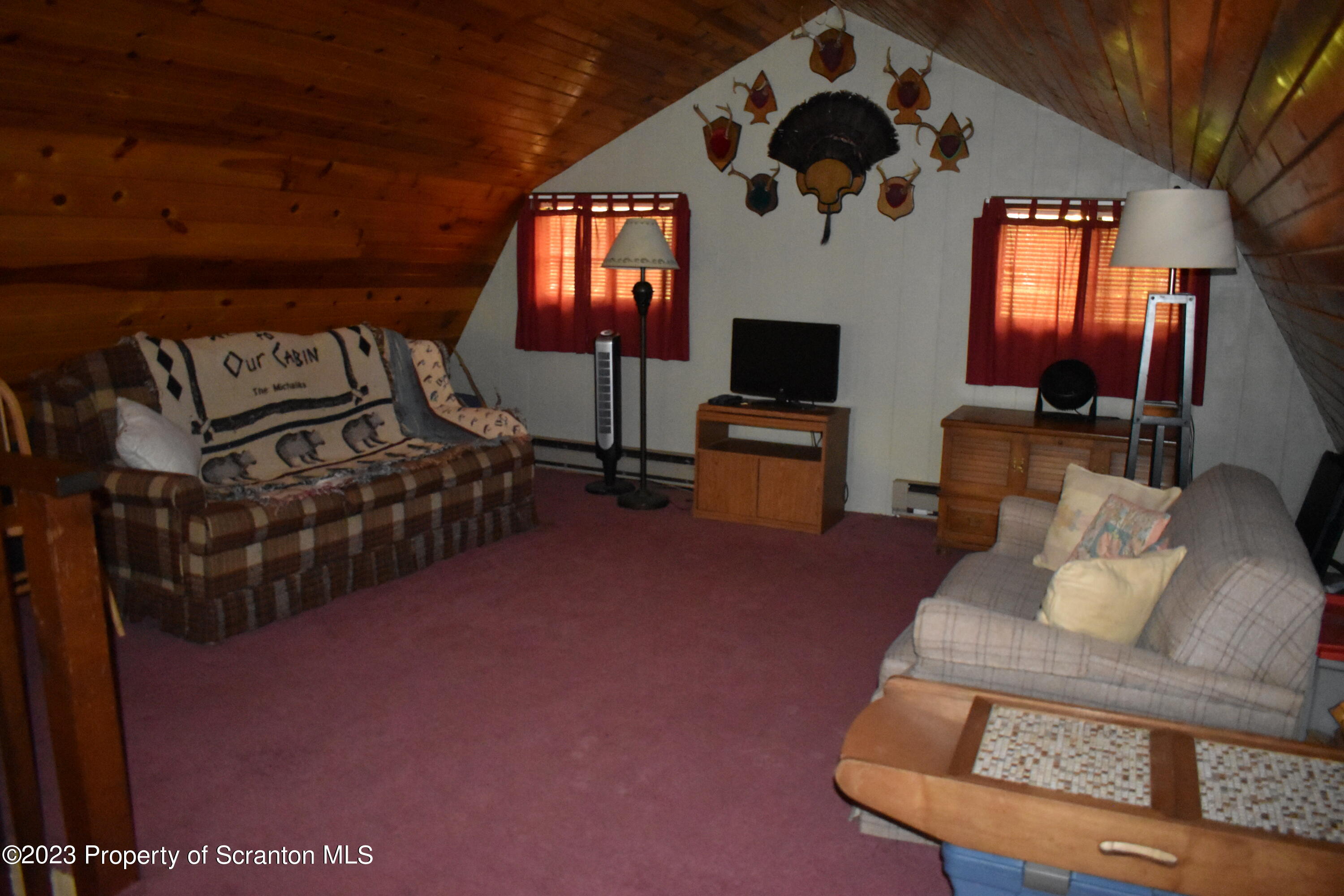 547 Camp Road New Milford, PA 18834 - Photo 16 of 27 a living room with furniture and a flat screen tv