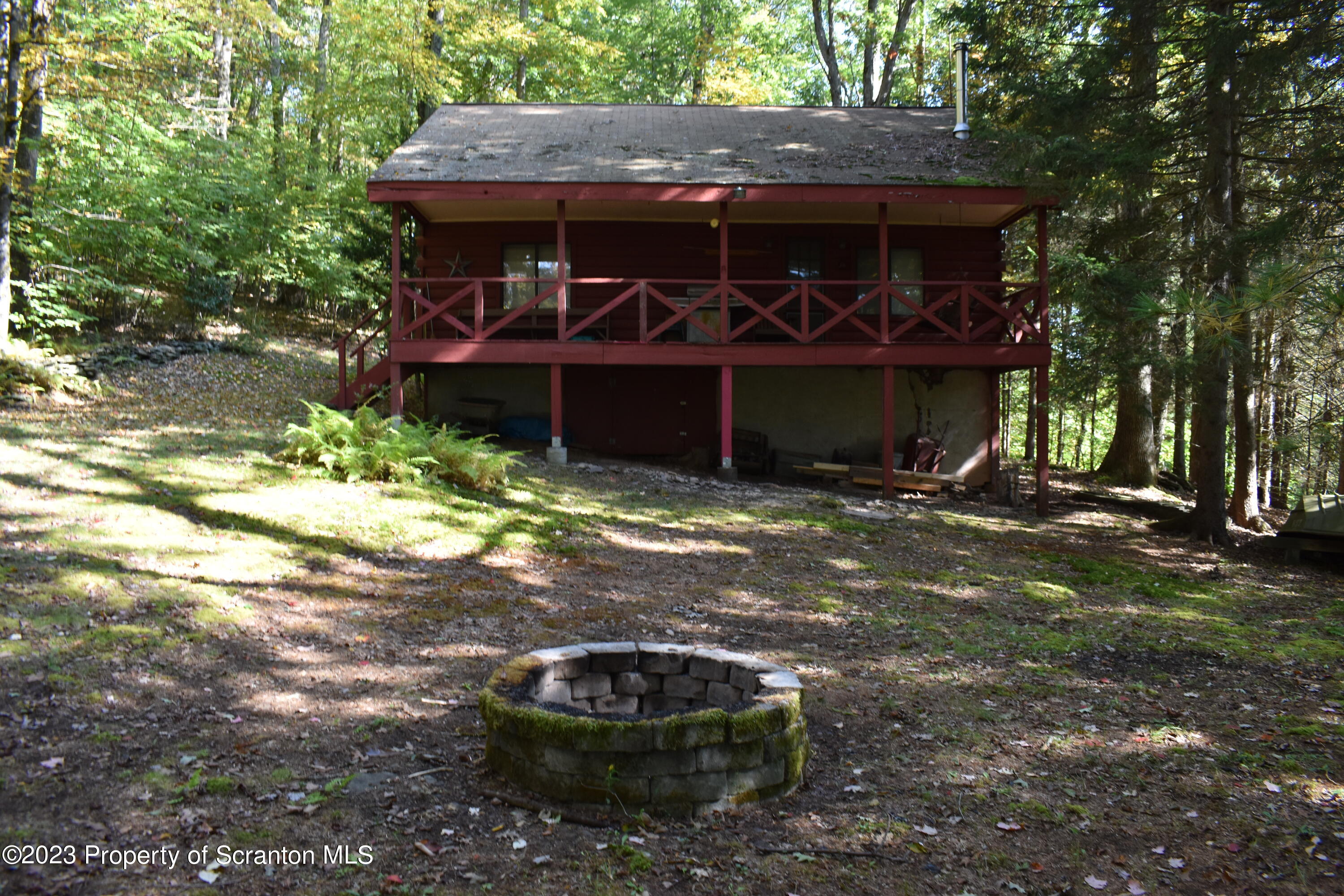 547 Camp Road New Milford, PA 18834 - Photo 22 of 27 a view of a small house with yard