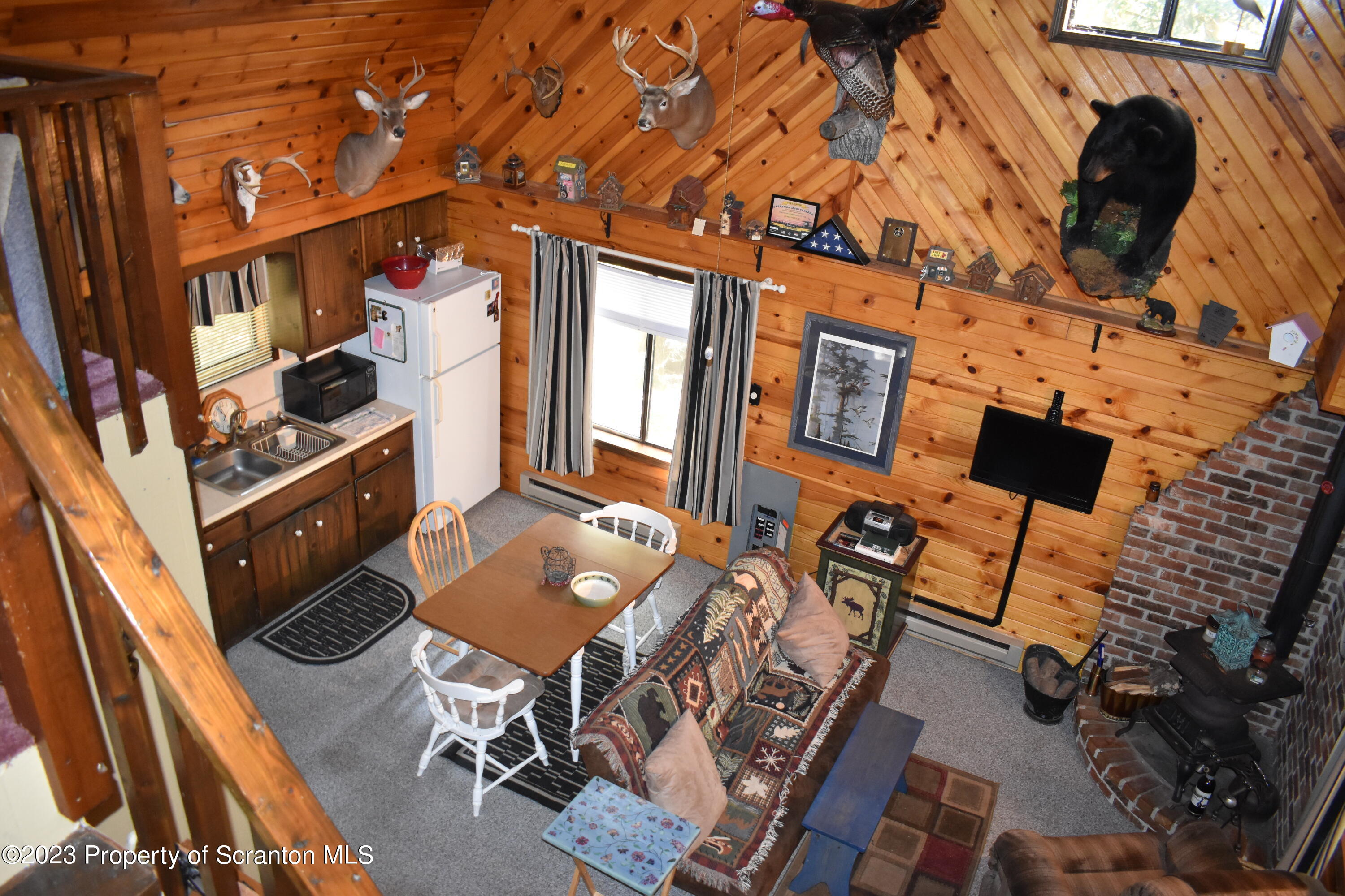 547 Camp Road New Milford, PA 18834 - Photo 7 of 27 front view of a living room with furniture and a floor to ceiling window