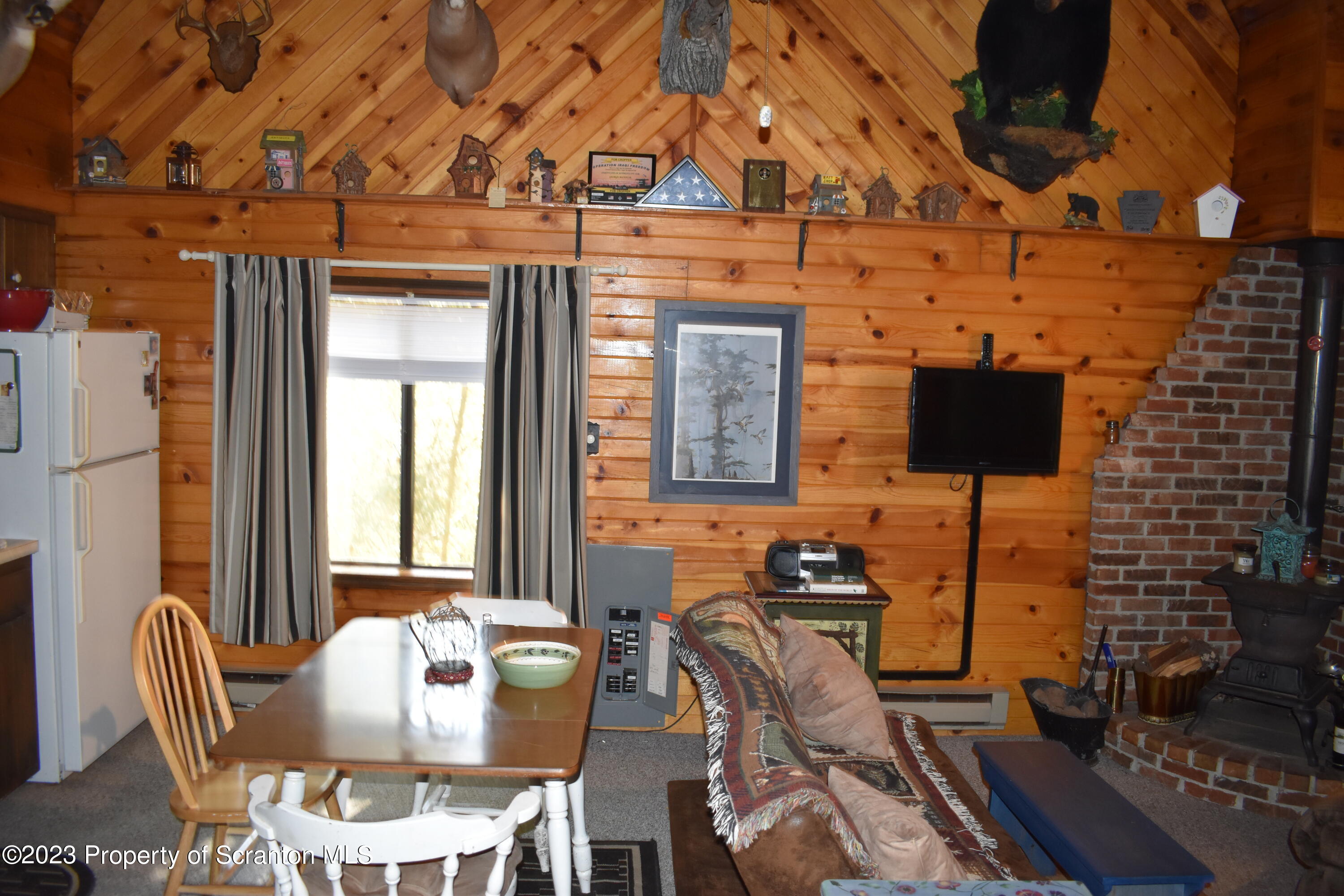 547 Camp Road New Milford, PA 18834 - Photo 10 of 27 a view of a dining room with furniture and chandelier