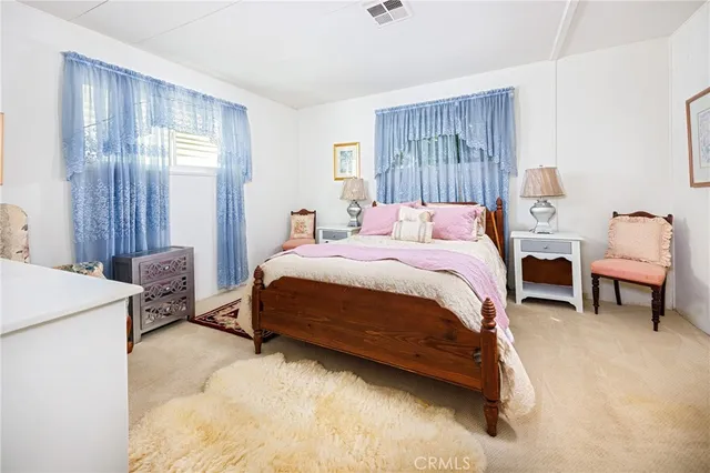 a bedroom with a bed and a table