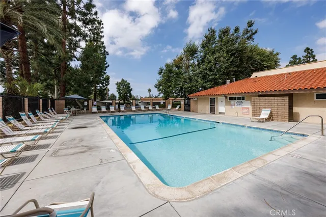 swimming pool view with a outdoor seating