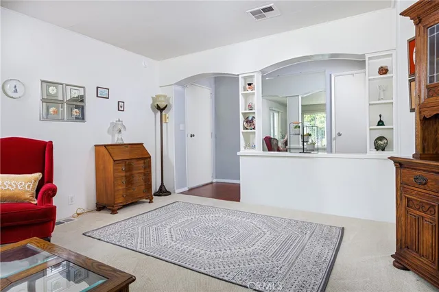 a bedroom with a bed and dresser
