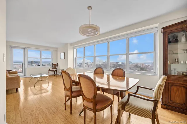 a view of a dining room with furniture window and outside view