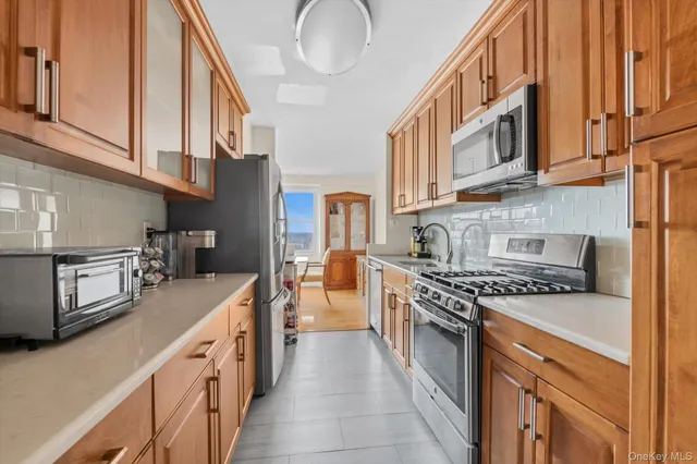 a kitchen with stainless steel appliances granite countertop a stove and a sink