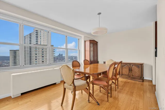 a dining room with furniture and window