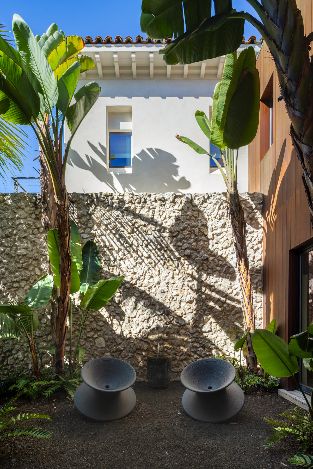 4160 La Ladera Road Santa Barbara, CA 93110 - Photo 16 of 63 a view of a porch with a potted plant and a fountain