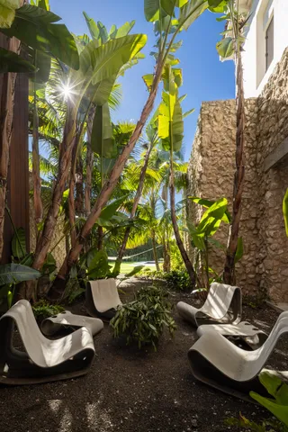 a terrace with outdoor seating and city view