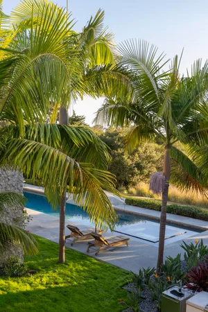 a view of a backyard with sitting area