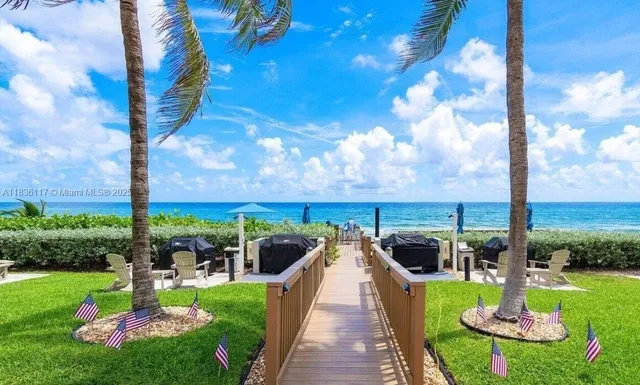 a view of a garden with furniture