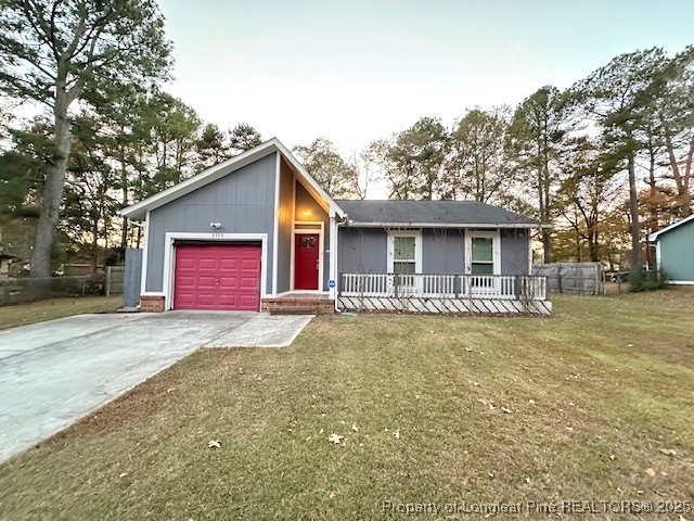 3305 Hunting Bay Drive Spring Lake, NC 28390 - Photo 1 of 15 a view of a big house with a yard and large tree