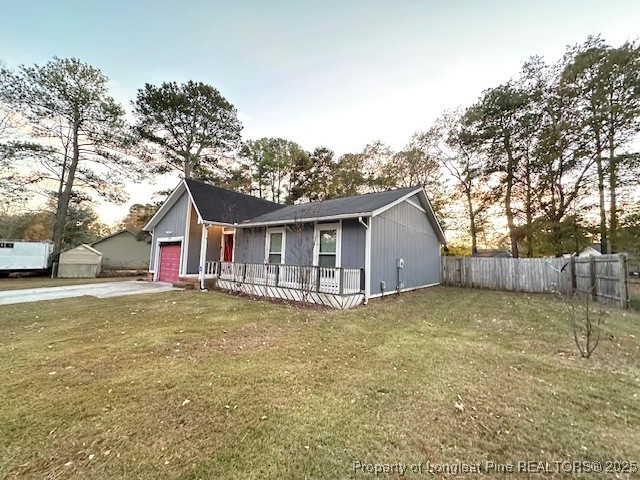 3305 Hunting Bay Drive Spring Lake, NC 28390 - Photo 6 of 15 a view of a house with a yard and garage