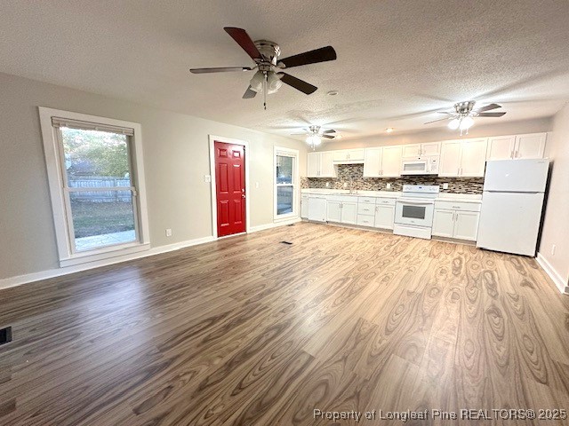 3305 Hunting Bay Drive Spring Lake, NC 28390 - Photo 15 of 15 a large white kitchen with wooden floor
