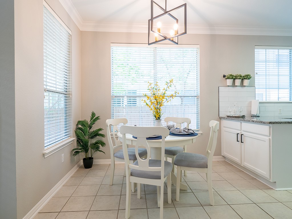 8518 Cahill Drive, Unit 47 Austin, TX 78729 - Photo 13 of 28 a dining room with furniture and window