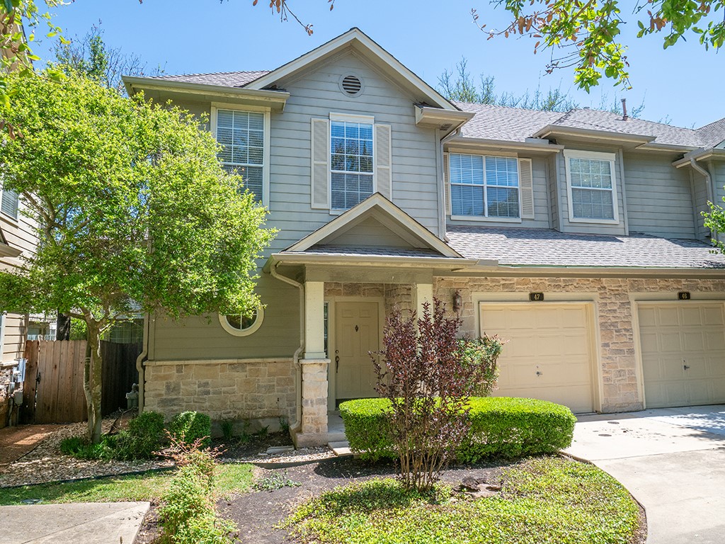 8518 Cahill Drive, Unit 47 Austin, TX 78729 - Photo 2 of 28 a front view of a house with garden