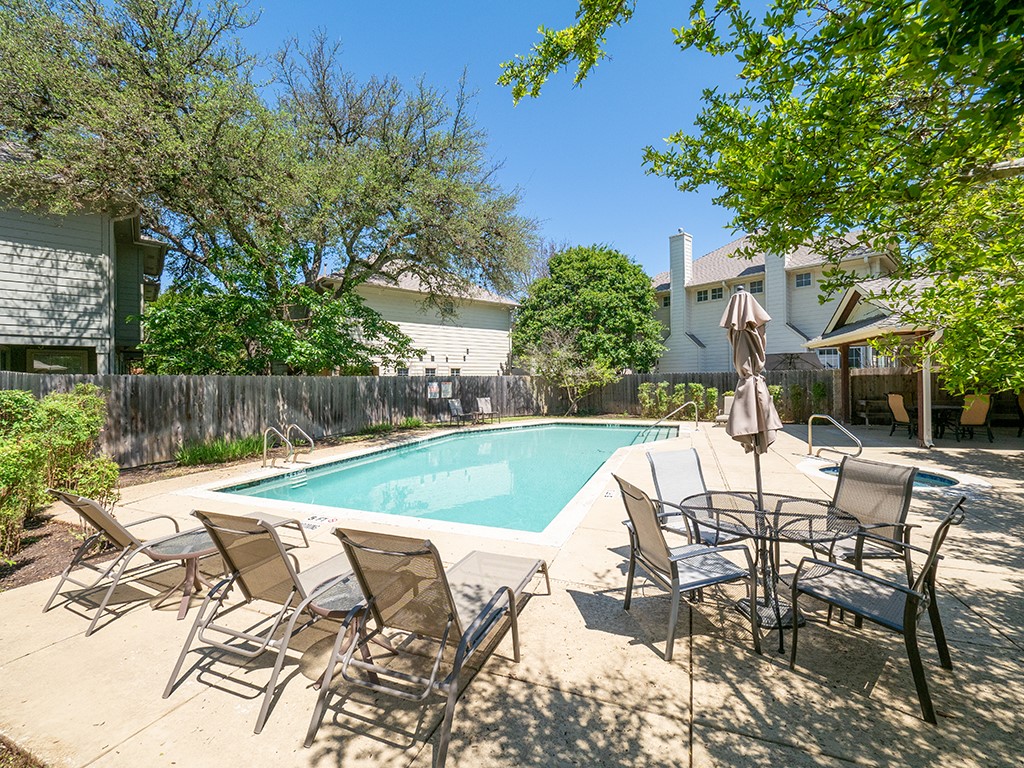 8518 Cahill Drive, Unit 47 Austin, TX 78729 - Photo 27 of 28 a view of backyard with swimming pool and patio