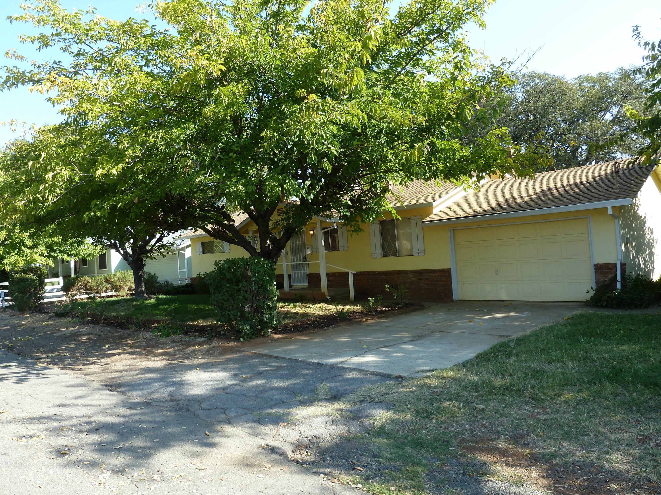 2755 Irwin Road Redding, CA 96002 - Photo 2 of 35 a view of a house with a yard and large trees