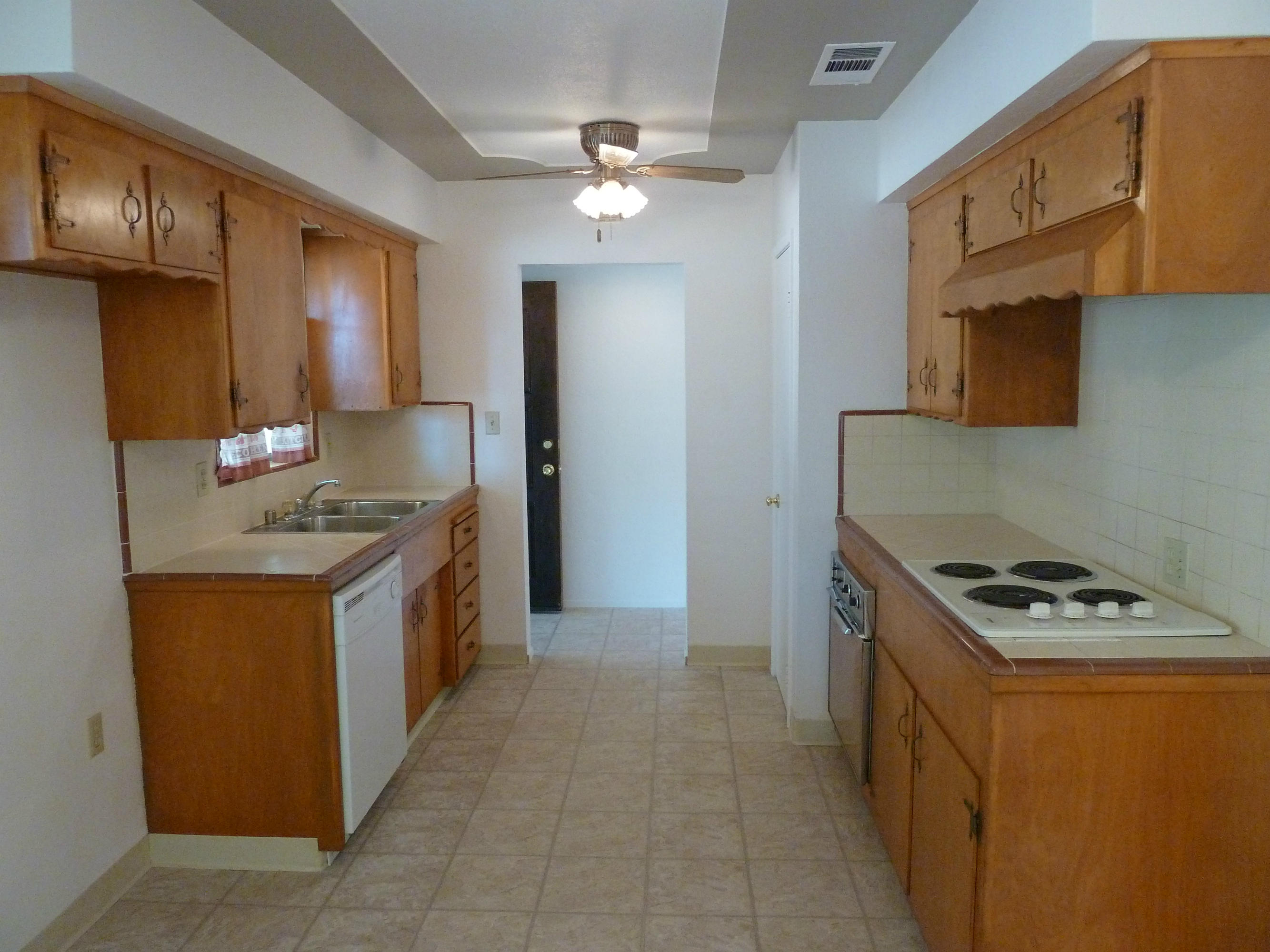2755 Irwin Road Redding, CA 96002 - Photo 8 of 35 a kitchen that has a sink a stove and a microwave oven