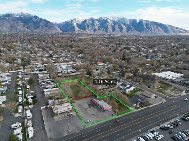 8475 South State Street Sandy, UT 84070 - Photo 6 of 31 Aerial overview of property's location with property parcel outlined and a mountain backdrop