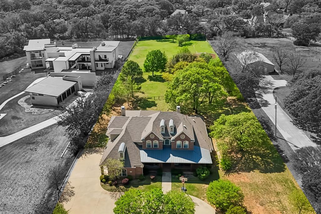 4604 Bill Simmons Road Colleyville, TX 76034 - Photo 2 of 22 an aerial view of a house with a yard and greenery